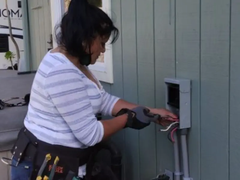 Licensed electrician wiring an exterior subpanel in Fort Leonard Wood