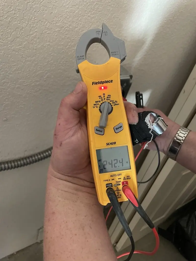 Voltage testing with clamp meter during Circuit Breaker Repair in Fort Leonard Wood